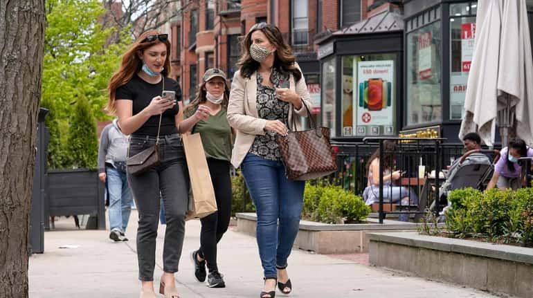 Pedestrians on Boston's Newbury Street on May 2, 2021.