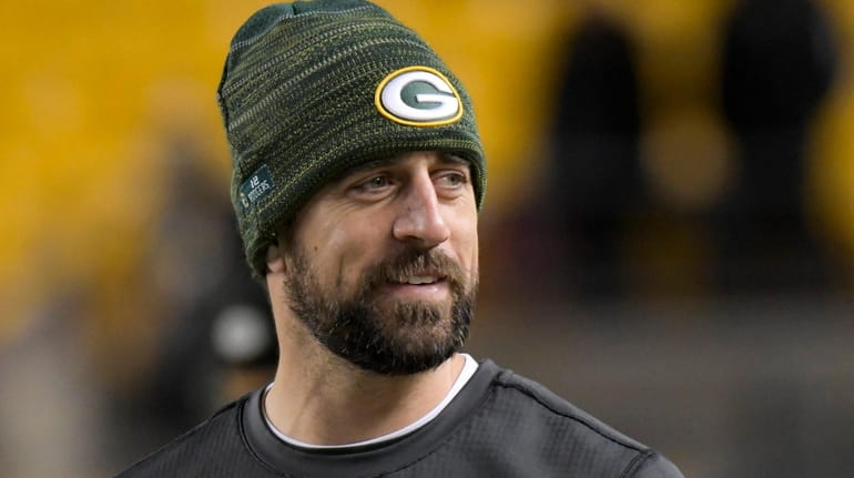 Green Bay Packers injured quarterback Aaron Rodgers watches warm ups...
