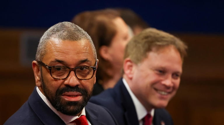 British Home Secretary James Cleverly, left, and Defence Secretary Grant...