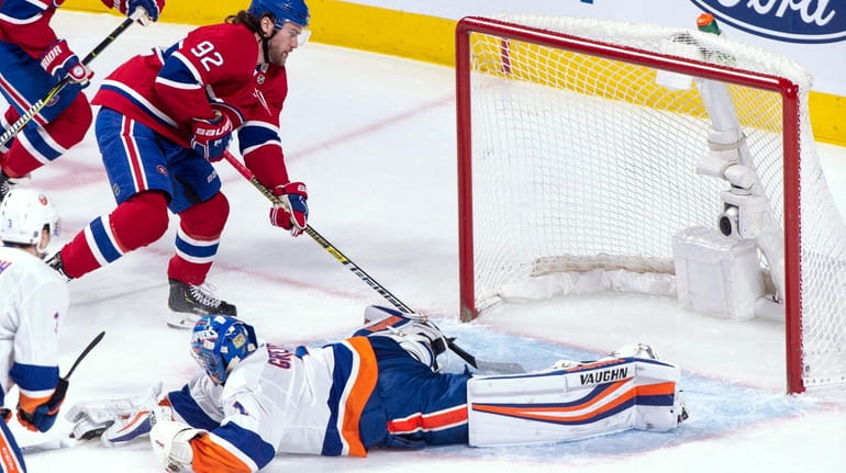 The Canadiens' Jonathan Drouin scores past Islanders goaltender Thomas Greiss during...