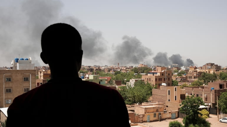 Smoke is seen in Khartoum, Sudan, on Saturday. The fighting...