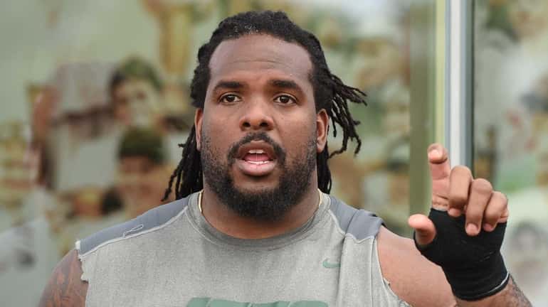 New York Jets guard Willie Colon speaks to the media...