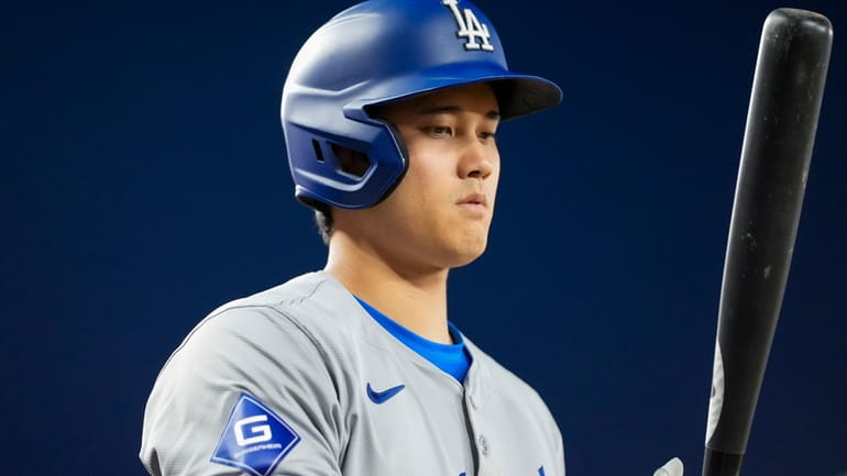 Los Angeles Dodgers designated hitter Shohei Ohtani prepares to bat...