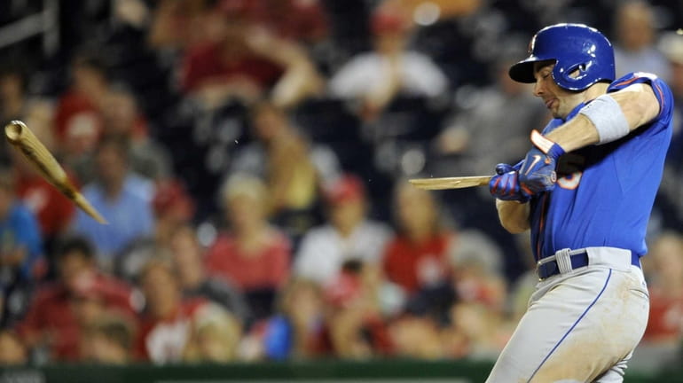 Mets' David Wright breaks his bat during the ninth inning...