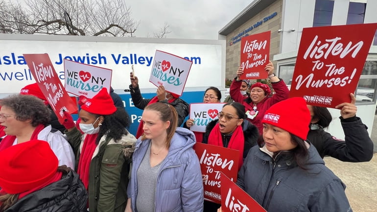 Nurses and health care professionals hold a rally at Long Island Jewish...