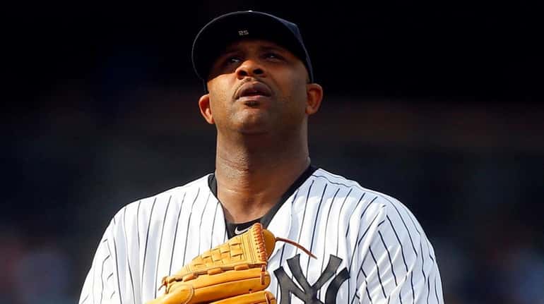 CC Sabathia of the New York Yankees stands on the...