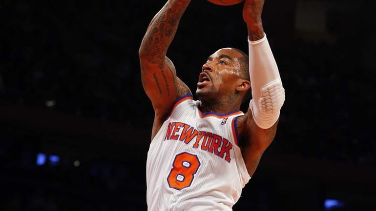 J.R. Smith of the Knicks goes to the hoop for...