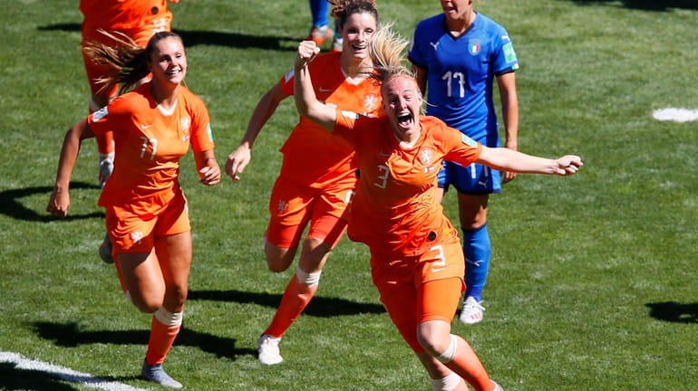 Netherlands' Stefanie Van Der Gragt, front, celebrates after scoring her...