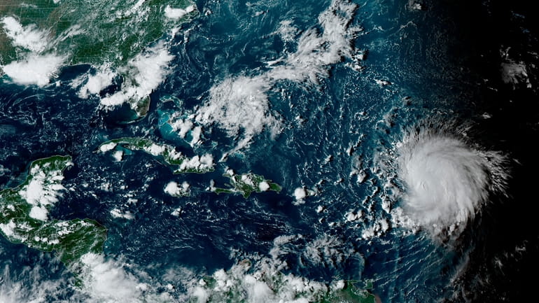 This satellite image provided by the National Oceanographic and Atmospheric...