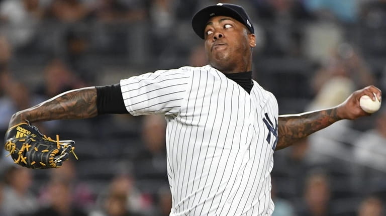 Yankees relief pitcher Aroldis Chapman delivers against the Red Sox...