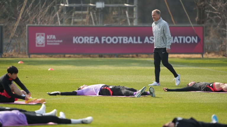 South Korea's new national team head coach Jurgen Klinsmann watches...