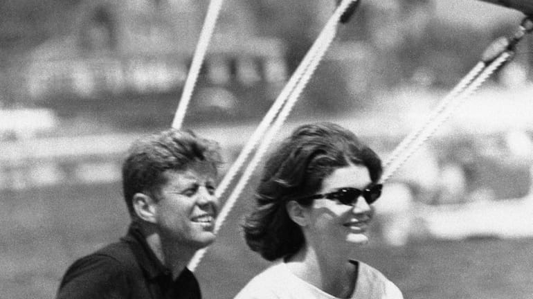 Then Sen. John Kennedy and his wife Jacqueline sit in...