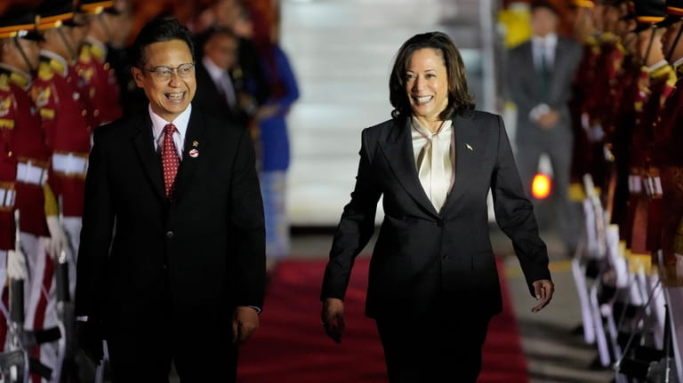 U.S. Vice President Kamala Harris, right, walks with Indonesian Health...