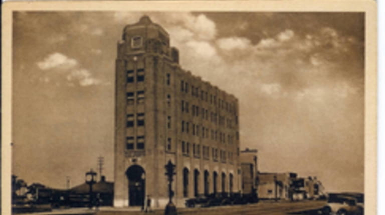 Black and white postcard of the First National Bank and...