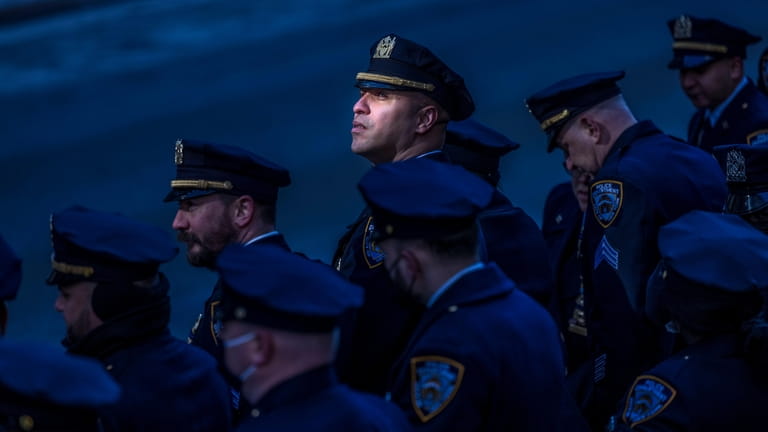 Exhibit Award, Face of New York. Police officers gather for the...