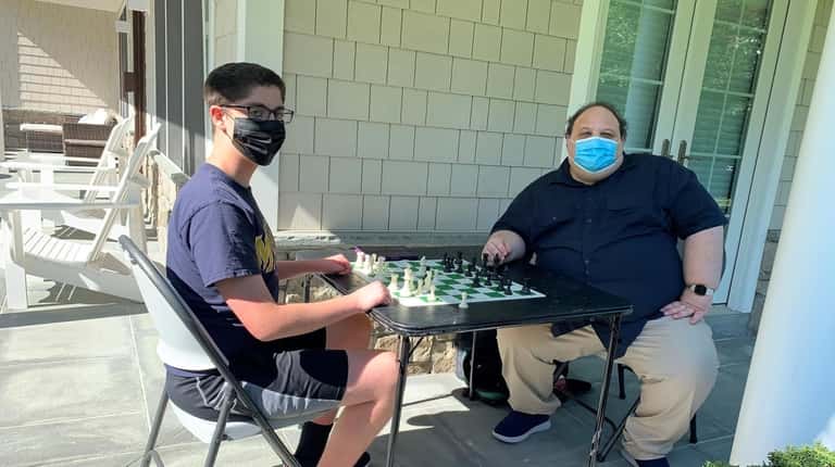 Brian Karen of Levittown teaches an at-home private chess lesson...