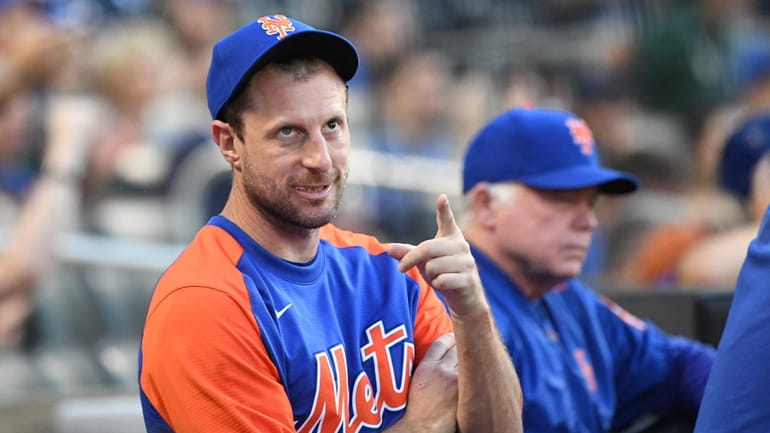 New York Mets pitcher Max Scherzer looks on from the...
