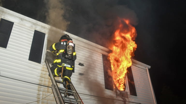 The North Babylon Fire Company battles a deadly house fire on...