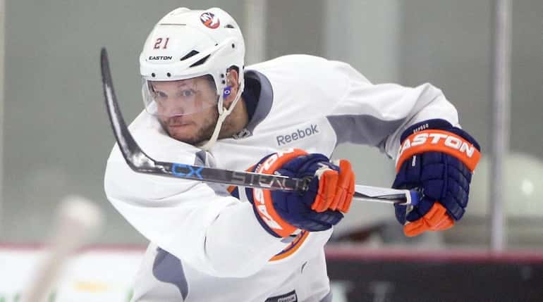 Kyle Okposo takes a shot at Islanders practice at iceworks...