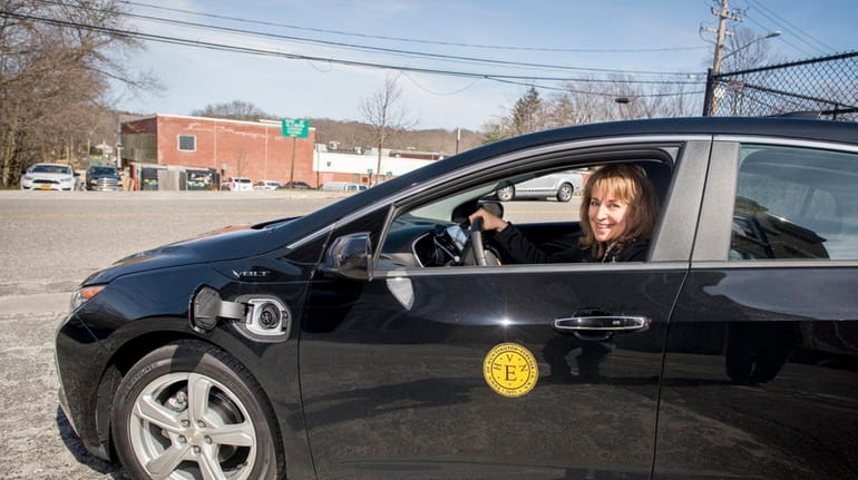 Terese Kinsley, Huntington's chief sustainability officer, with the town's hybrid...