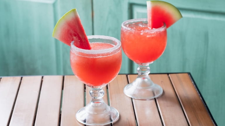 The top shelf watermelon margarita comes two ways, on the...