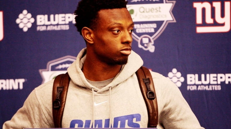 First-round draft pick Eli Apple speaks to the media during...