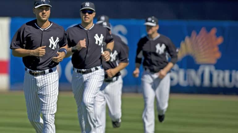 Derek Jeter and Mark Teixeira work out with the team...
