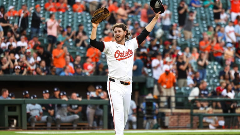 Baltimore Orioles' starting pitcher Cole Irvin reacts after Minnesota Twins'...