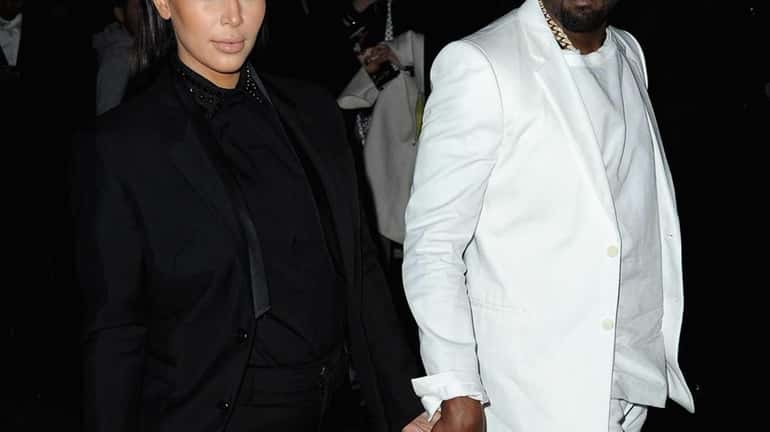 Kim Kardashian and Kanye West attend Givenchy Fall/Winter 2013 Ready-to-Wear...