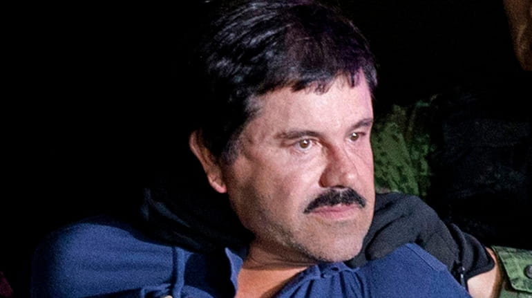 Drug lord Joaquin "El Chapo" Guzmán Loera is made to...