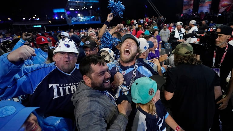 Tennessee Titans fans cheer during the third round of the...