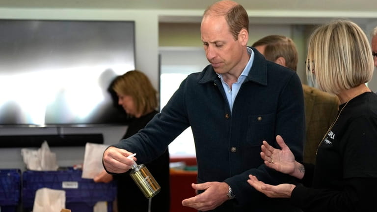 Britain's Prince William is shown items by Claire Hopkins, Operations...