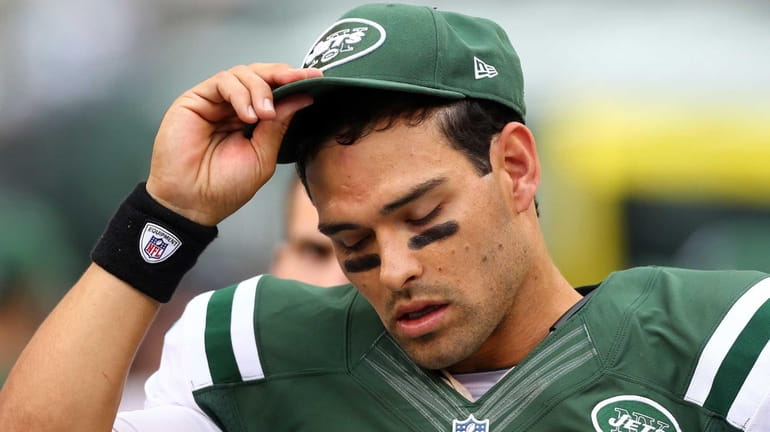 Mark Sanchez looks on from the bench during the fourth...