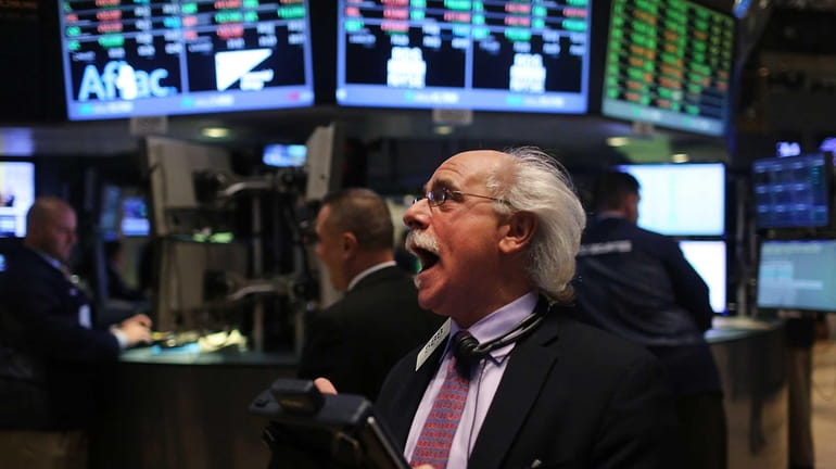 A trader on the floor of the New York Stock...