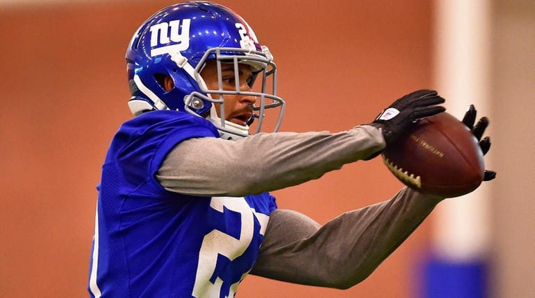 New York Giants safety Darian Thompson (27) makes a catch...