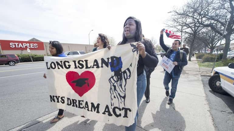 Immigration activists march along Front Street in Hempstead on May...