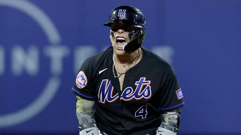 Francisco Alvarez #4 of the Mets celebrates his tenth inning RBI...