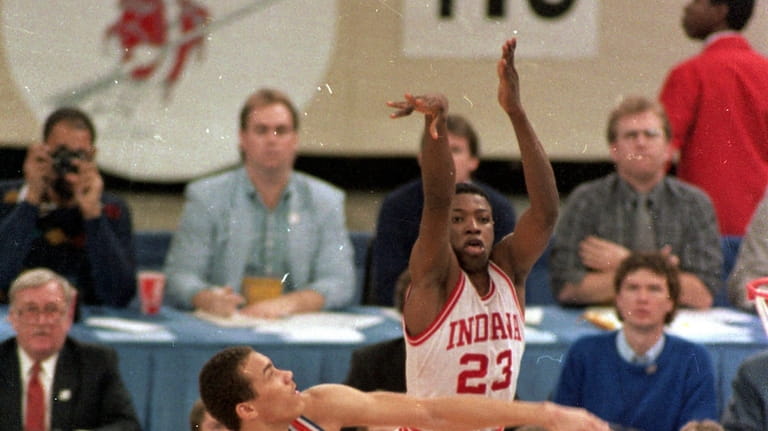 Indiana's Keith Smart (23) fires a shot past Syracuse's Howard...