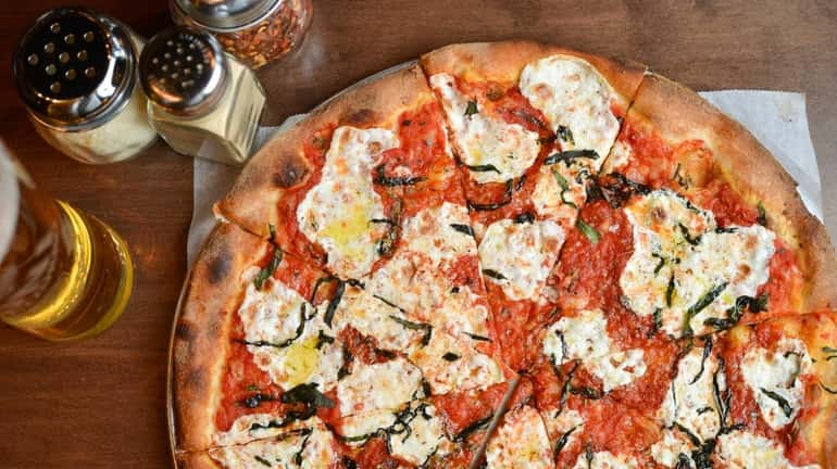 Brick-oven Margherita pizzette is crisp and puffy at Spuntino in...