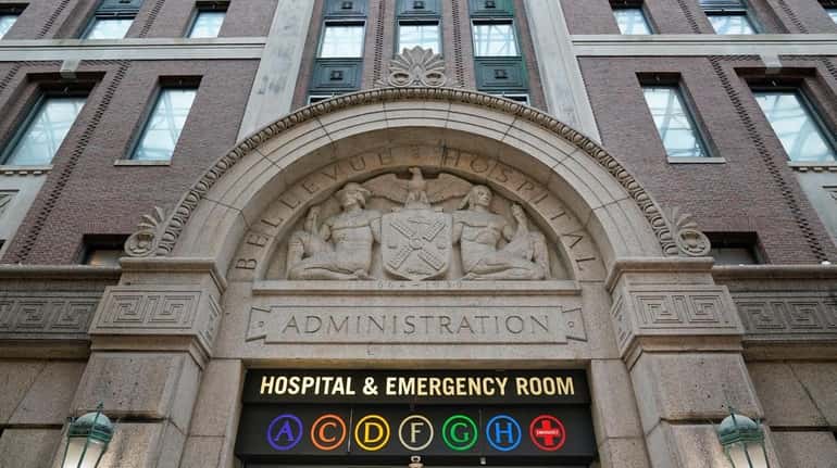 A sign at Bellevue Hospital in Manhattan signals the way to...
