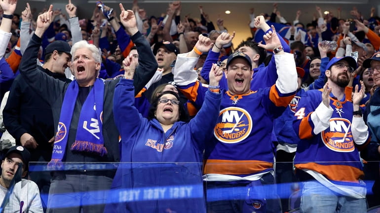 Islanders fans cheer late in the third period against the...