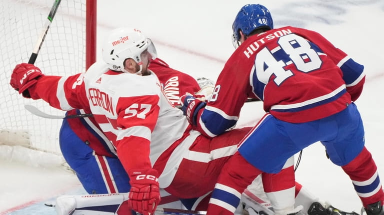 Montreal Canadiens' Lane Hutson (48) battles Detroit Red Wings' David...