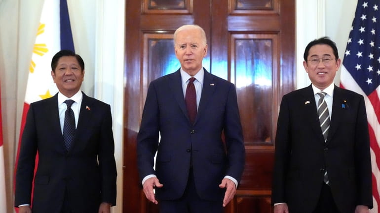 President Joe Biden, center, Philippine President Ferdinand Marcos Jr., left,...