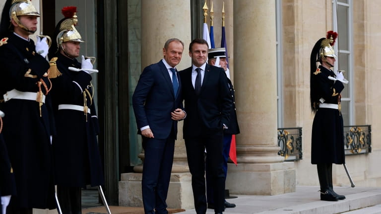 French President Emmanuel Macron, center right, welcomes Poland's Prime Minister...