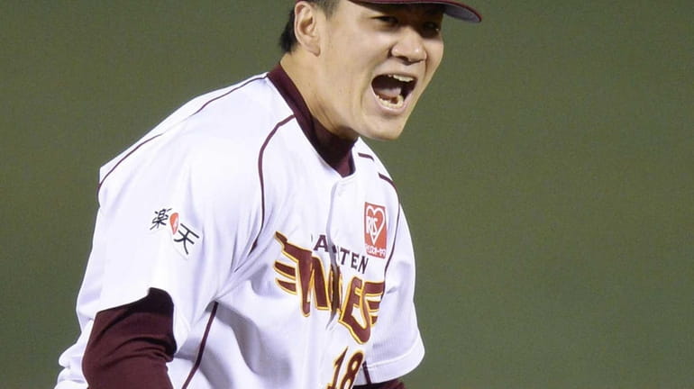 Rakuten Eagles starter Masahiro Tanaka celebrates his complete-game victory agsinst...