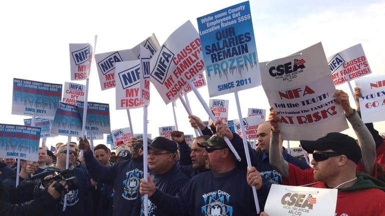 Nassau County workers rally outside the Uniondale Marriott on March...