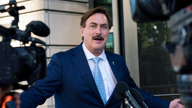 MyPillow chief executive Mike Lindell speaks to reporters outside federal...