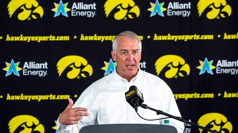 University of Iowa Athletic Director Gary Barta answers questions during...