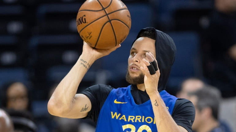 The Warriors' Stephen Curry practices in preparation for Game 6...