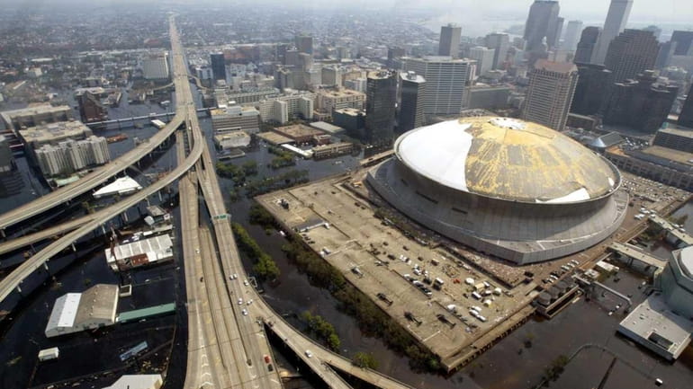 Storm-surge flooding surrounded the Superdome in New Orleans after Hurricane...